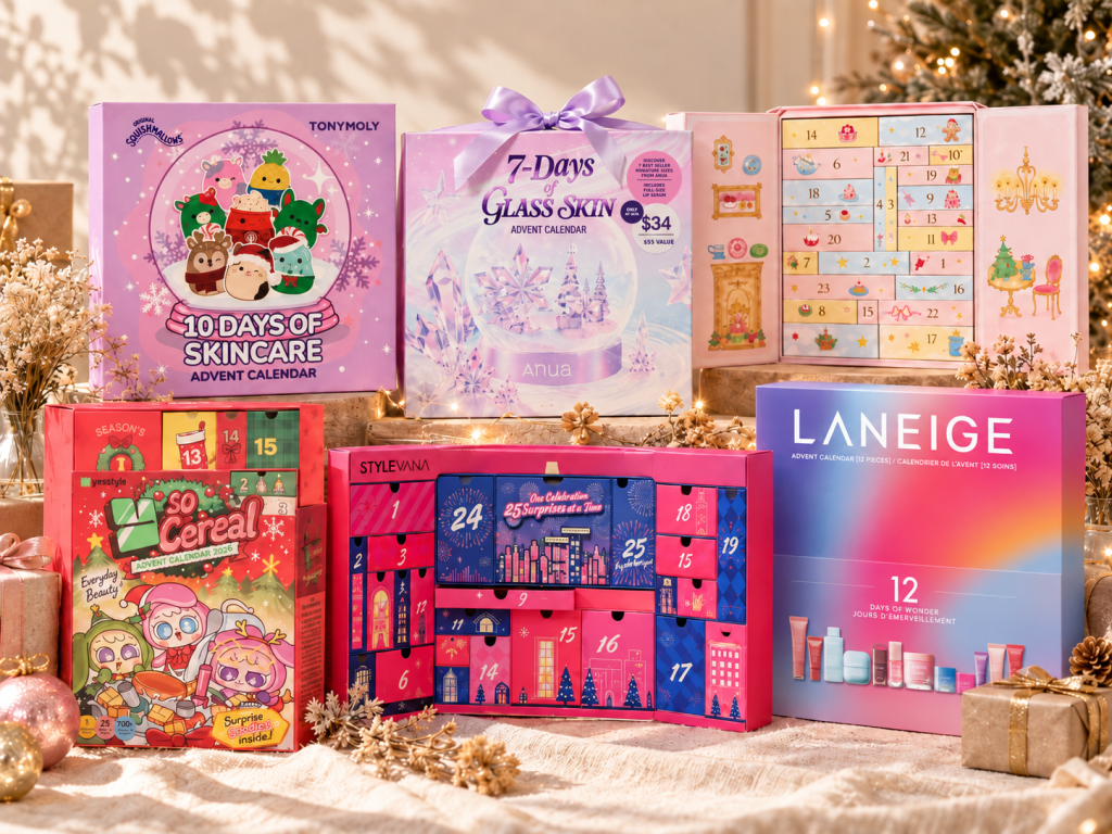 Six K-beauty advent calendars for 2026 from TONYMOLY, ANUA, Kiokii, YesStyle, Stylevana and LANEIGE arranged together on a cozy holiday table